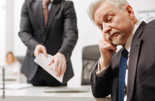 Indifferent employer expressing apathy in the office photo