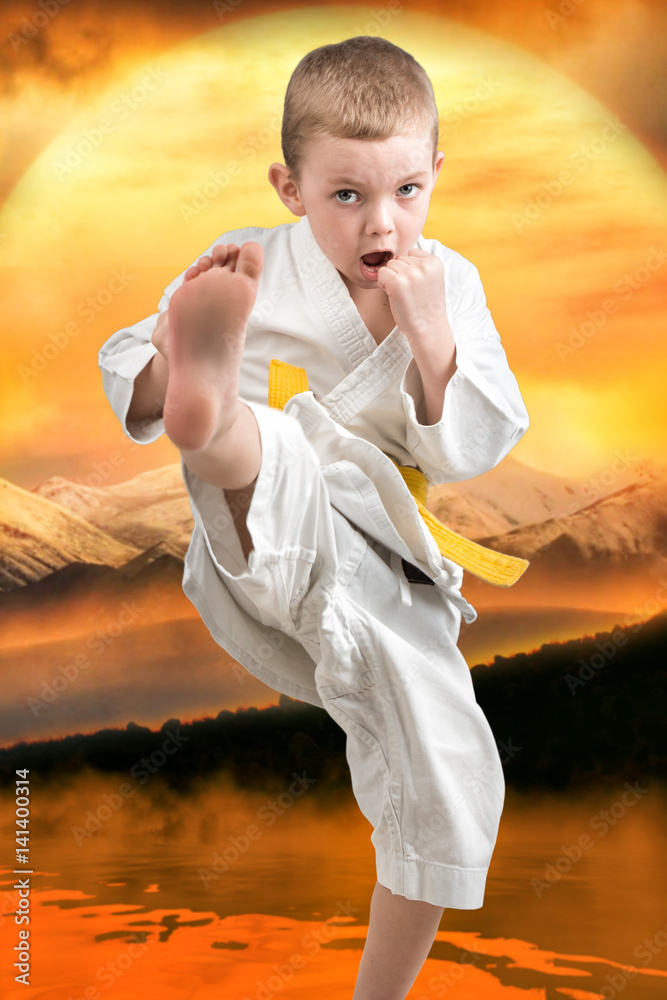 Little boy karate shows the techniques of the Japanese martial art of