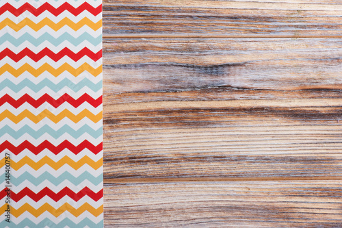 Colorful chevron tablecloth on wooden table