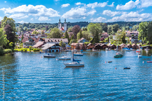 Tutzing am Starnberger See unter weiß-blauem Himmel und Segelyachten in der Bucht photo