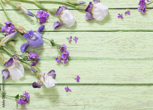 flowers on green wooden background