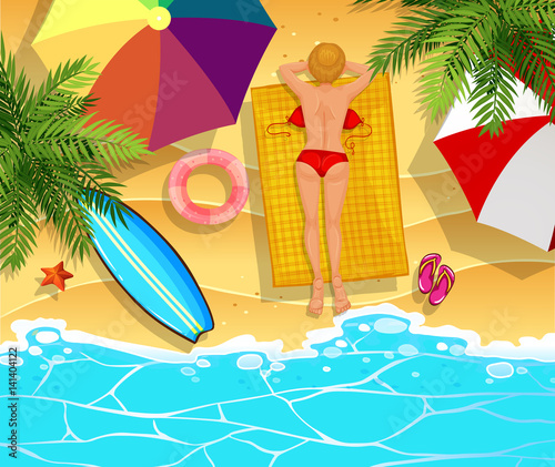 Woman sunbathing on the beach
