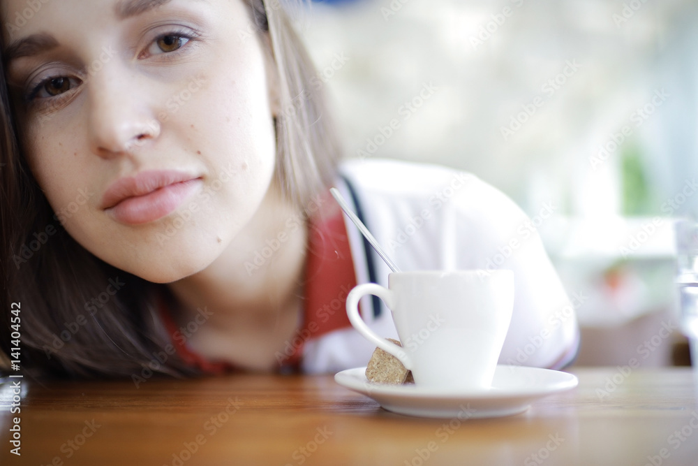Woman having lunch in summer restaurant blurred background Woman having lunch in summer restaurant blurred background