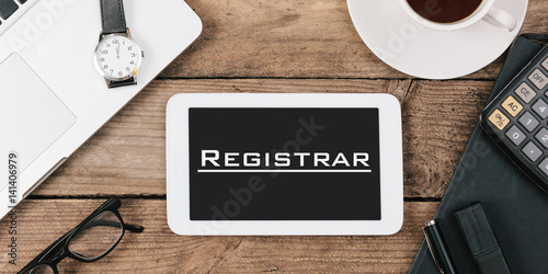 Registrar, Portuguese text for Register on screen of tablet computer at office desk