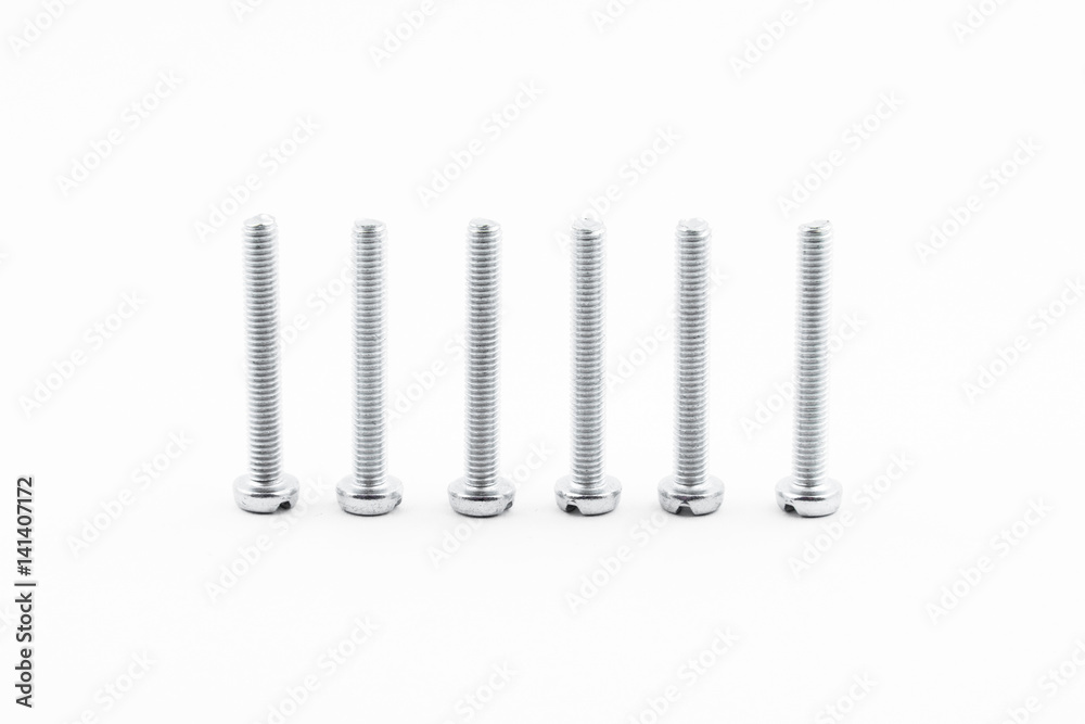 Closeup silver zinc coated screw isolate on white background. The threaded screws to M4. Isolated fasteners. Connecting material on white background. Silver threads on bolts. Closeup silver zinc coated screw isolate on white background. The threaded screws to M4. Isolated fasteners. Connecting material on white background. Silver threads on bolts.
