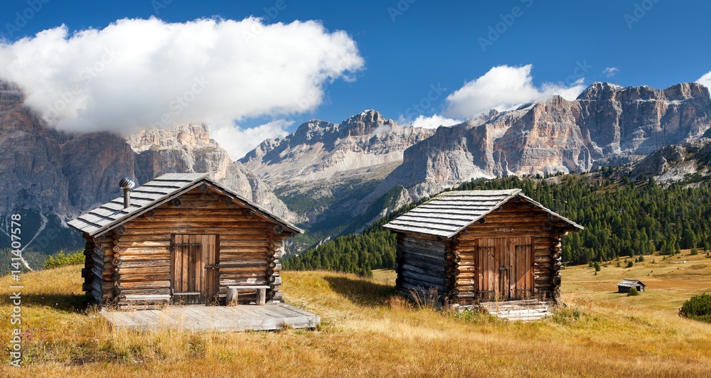 wooden small cabin in dolomities alps mountains