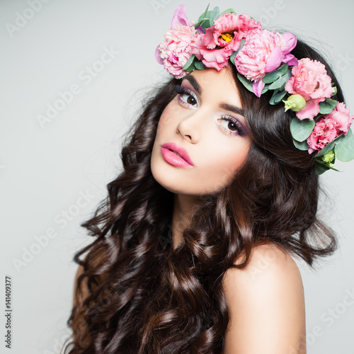 Beauty Face. Cute Woman with Curly and Flowers