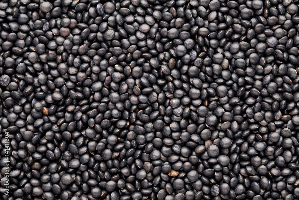 Food and cookery background of healthy dried black lentils. Food and cookery background of healthy dried black lentils.