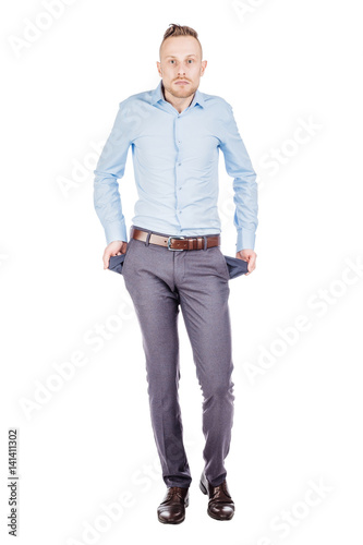Portrait of an expressive businessman showing his empty pockets