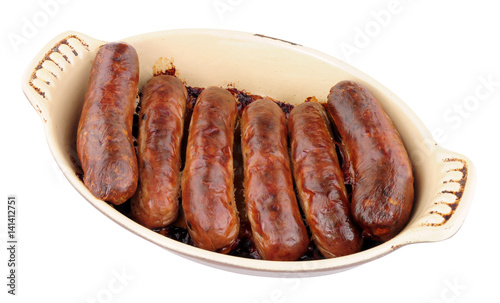 Baked Sausages In An Oven Dish Isolated On A White Background