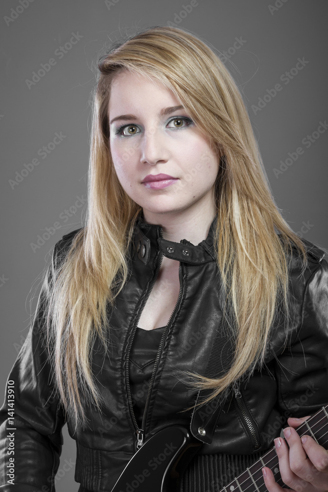 Fototapeta premium Heavy, Beautiful blonde with black electric guitar