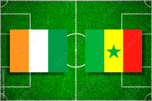 Flag of Côte d'Ivoire - Senegal on the football field. football friendly match