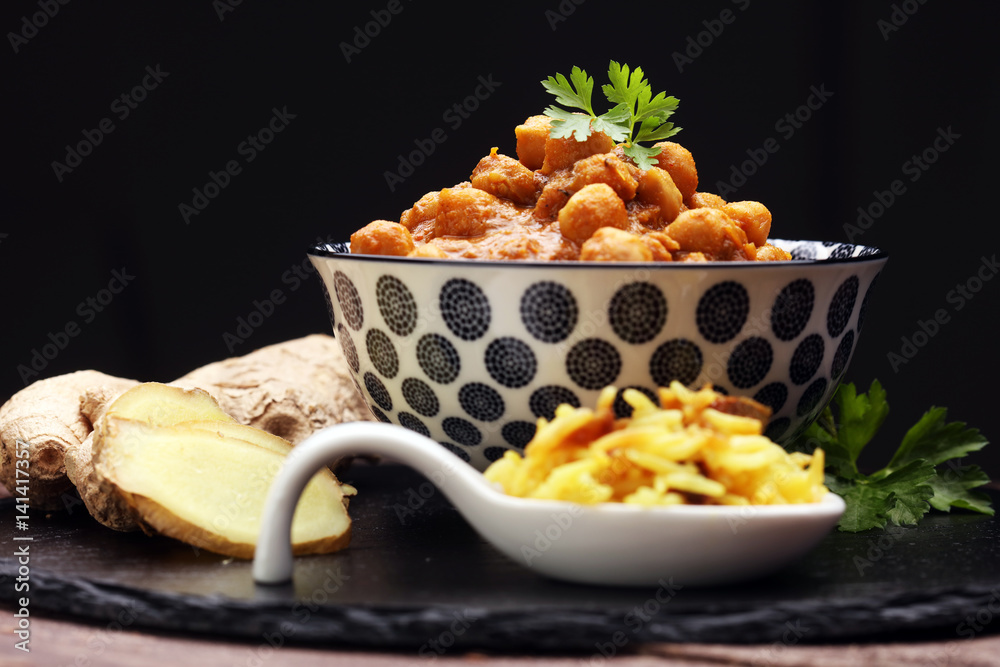 Chana Masala indian dish spicy Chick Peas also known as Chola Masala or Chole served in a white bowl Chana Masala indian dish spicy Chick Peas also known as Chola Masala or Chole served in a white bowl