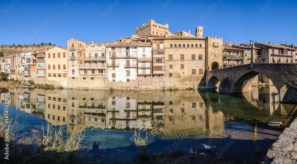 Reflection in the river in Valderrobres, Spain