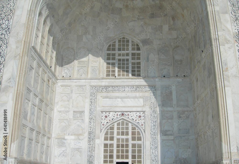 Close perspective angle of the Taj Mahal mausoleum in Agra, India, with the main building entry portal 