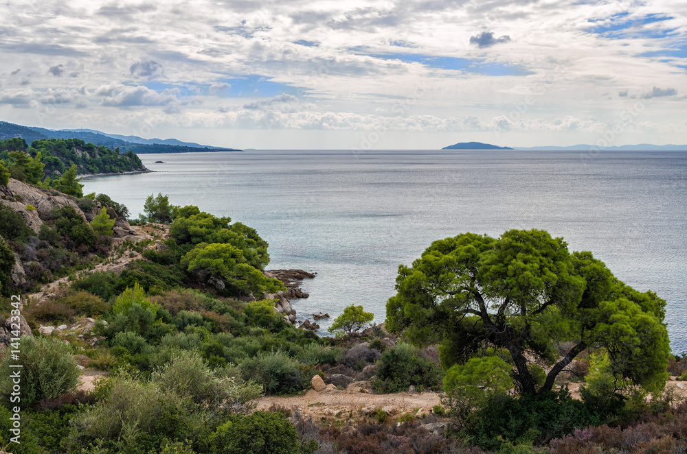 Gorgeous scenery by the sea under a cloudy sky in Sithonia, Chalkidiki, Greece 