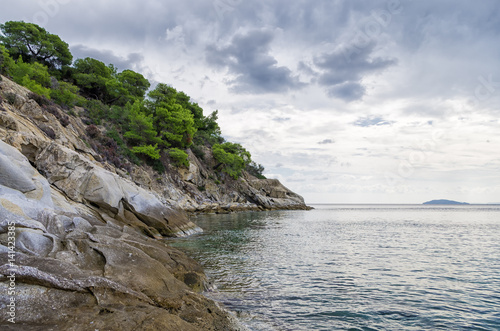 Gorgeous scenery by the sea under a cloudy sky in Sithonia, Chalkidiki, Greece © kokixx