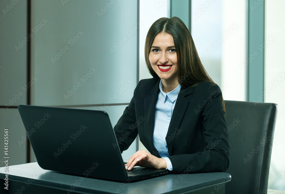 Businesswoman working in her office Businesswoman working in her office