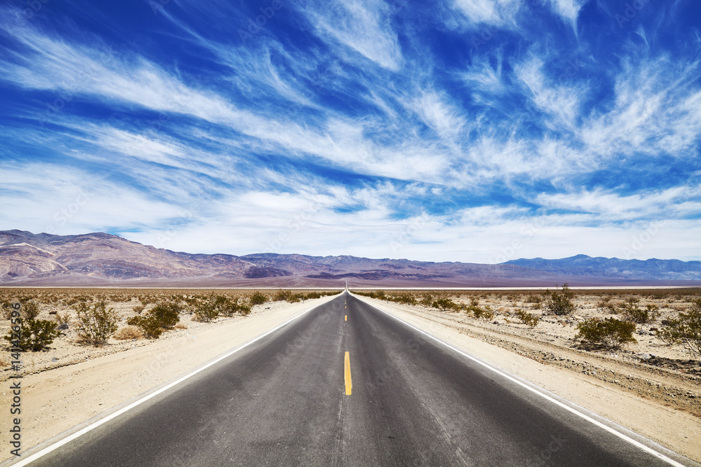 Endless desert road in the Death Valley, travel concept, USA. Endless desert road in the Death Valley, travel concept, USA.