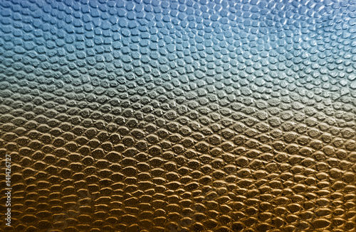 Blue and golden snake skin texture background