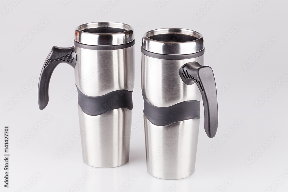 Stainless steel coffee mugs isolated on white Stainless steel coffee mugs isolated on white