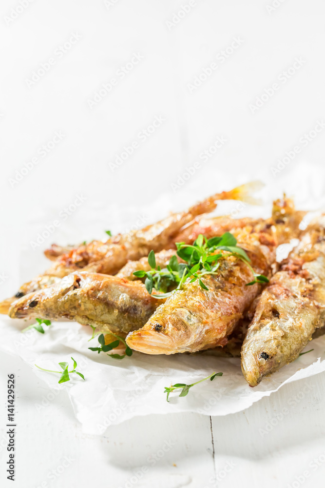 Tasty roasted smelt fish with salt and herbs Tasty roasted smelt fish with salt and herbs