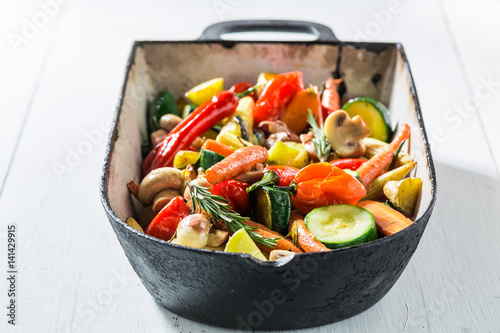 Grilled vegetables with potatoes, carrots and peppers in casserole