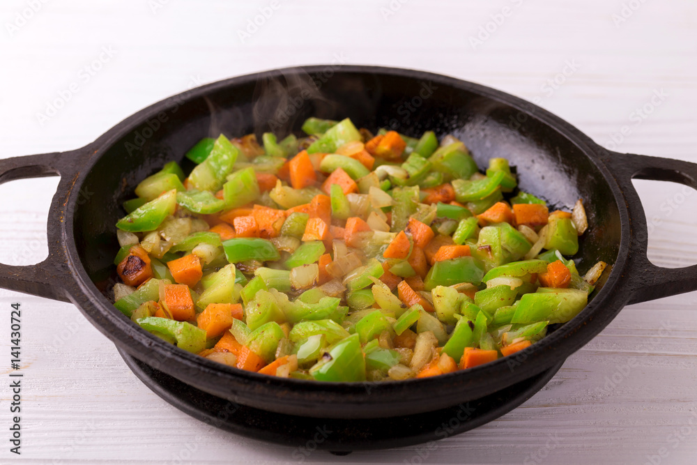 Cooking. Bell pepper, carrot and onion stew in pan Cooking. Bell pepper, carrot and onion stew in pan