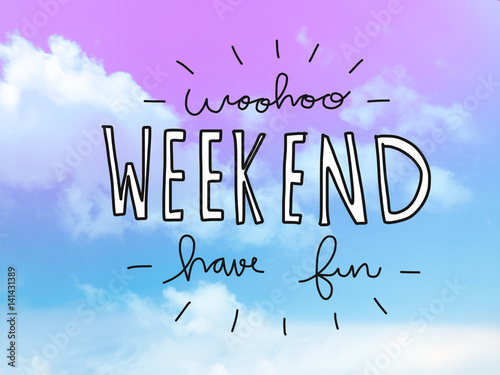 Woohoo weekend have fun word on pink and blue pastel sky photo