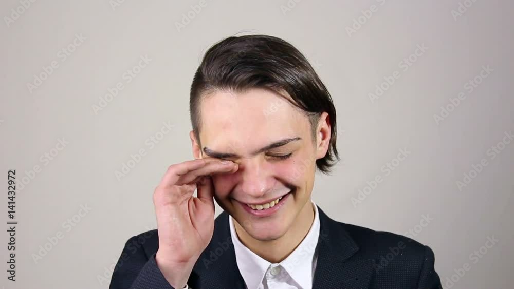 Businessman laughing and looking at the camera Businessman laughing and looking at the camera