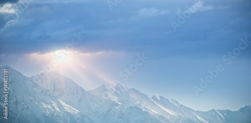 Snowy mountain range against clear blue sky