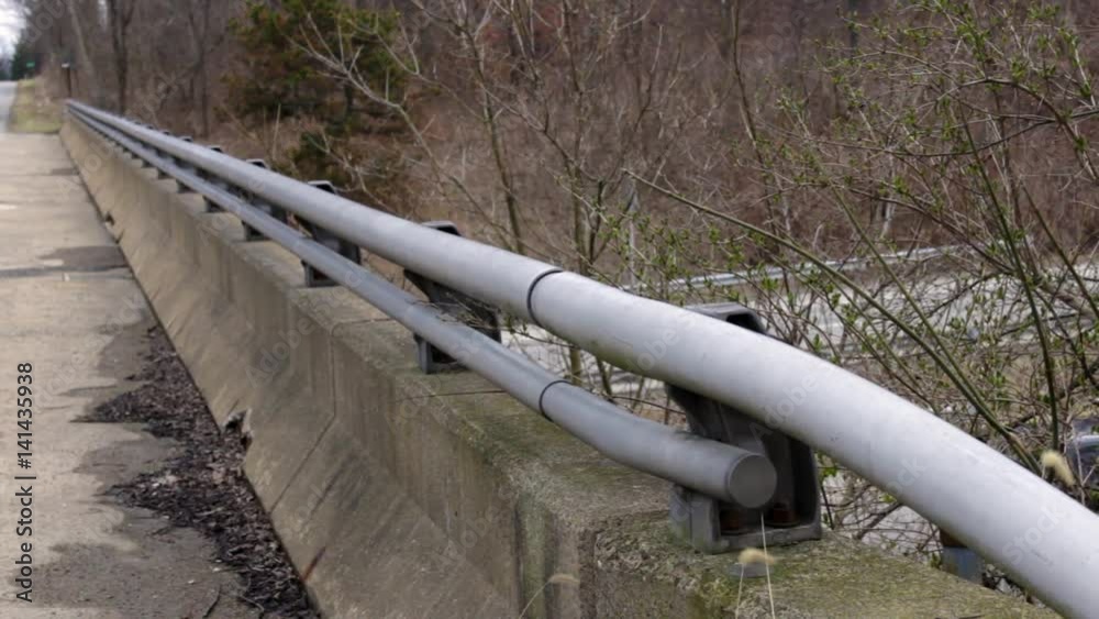 Old Overpass Guardrail with defocused traffic Old Overpass Guardrail with defocused traffic
