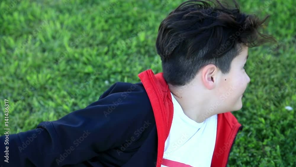Portrait of young happy teen boy looking at camera and smiling at the outdoors Portrait of young happy teen boy looking at camera and smiling at the outdoors