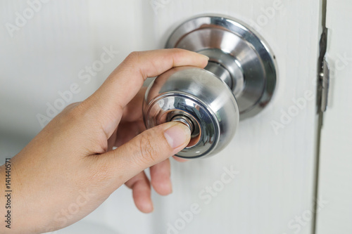 hand press botton on door knob for lock the door