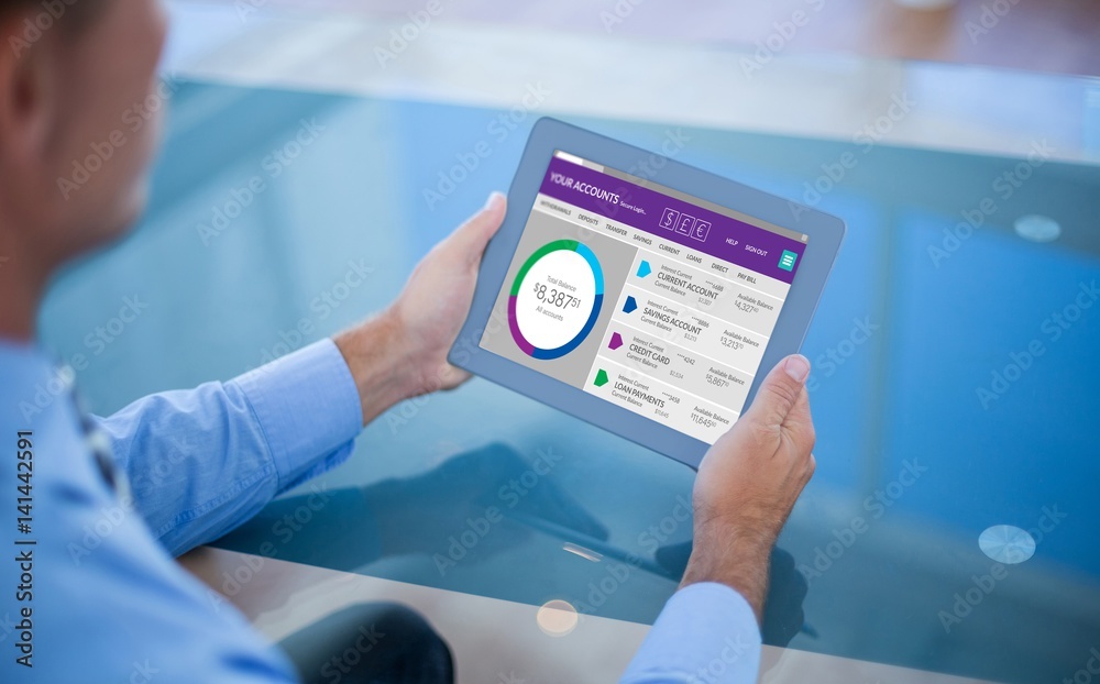 Composite image of businessman using his tablet Composite image of businessman using his tablet