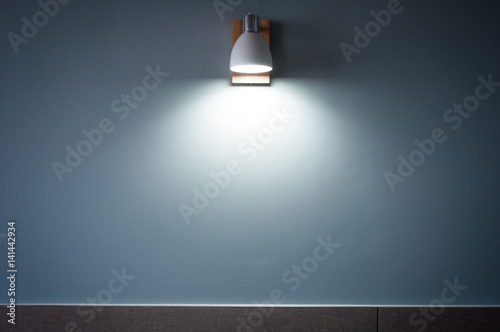 the White Light Beam from lamp on blue wallpaper background