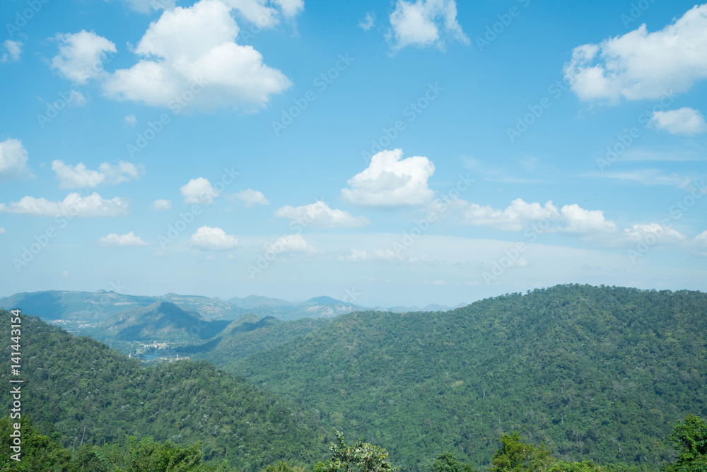 Fototapeta premium mountains landscape under sky with clouds and sun light