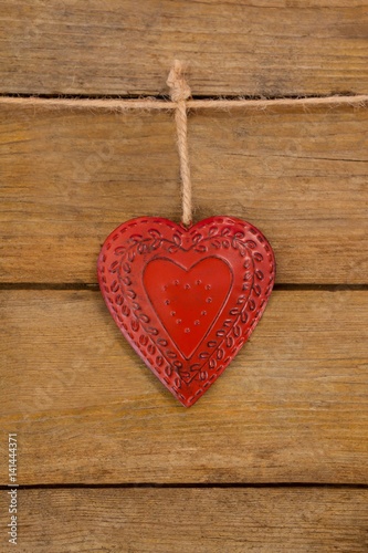 Red textured heart hanging on rope