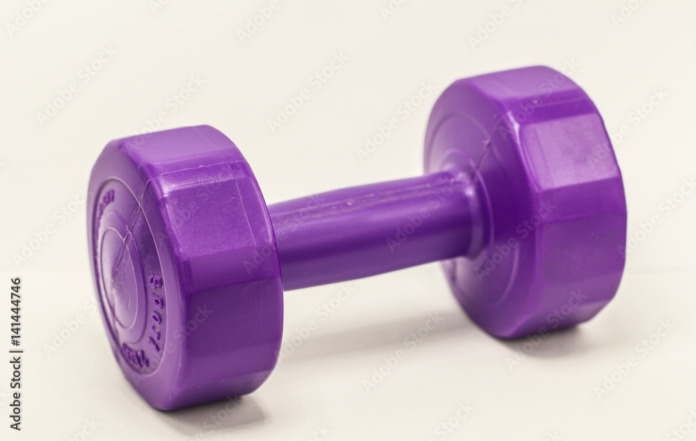 purple dumbbells plastic isolate on white background purple dumbbells plastic isolate on white background