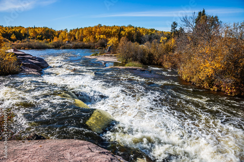 Foam water rapids on the stones photo