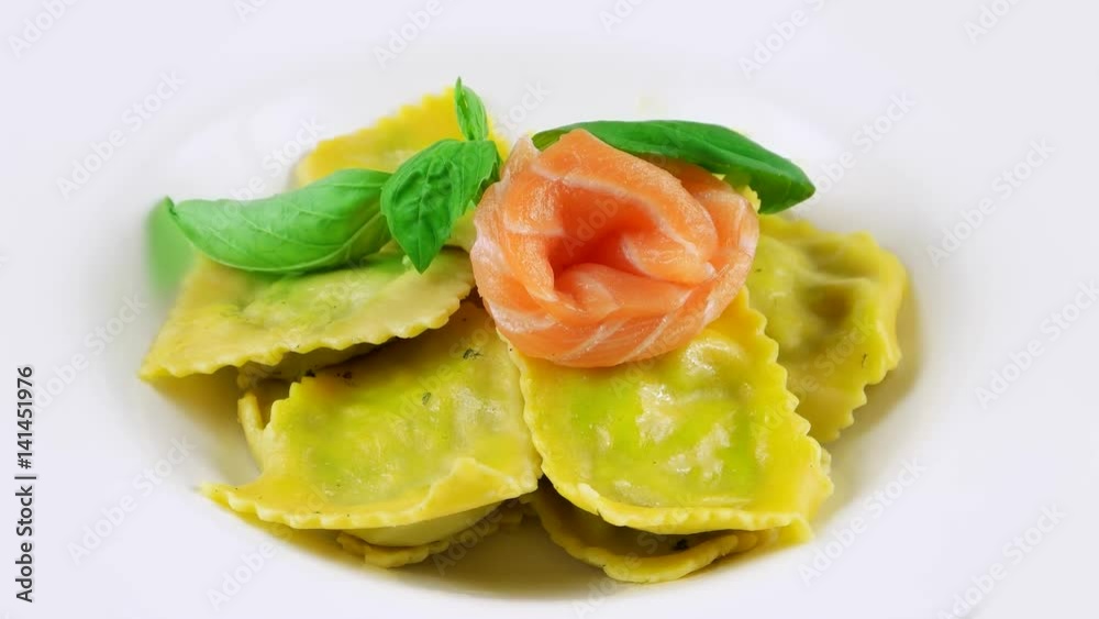 Traditional Italian ravioli filled with ricotta cheese, salmon and basil leaf
Traditional Italian ravioli filled with ricotta cheese, salmon and basil leaf