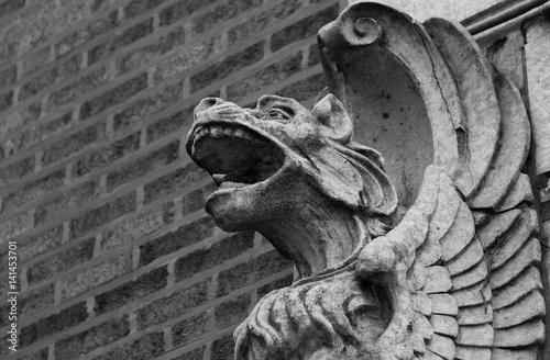 Stone gargoyles on a wall photo