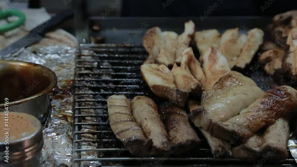 Asian people buying mushroom BBQ in the night market of Jiufen Old Street, famous marketplace with delicious food in Chiufen city near Keelung, Taiwan.-Dan Asian people buying mushroom BBQ in the night market of Jiufen Old Street, famous marketplace with delicious food in Chiufen city near Keelung, Taiwan.-Dan