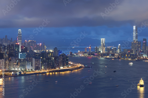 Panorama of Victoria Harbor of Hong Kong at night © leeyiutung