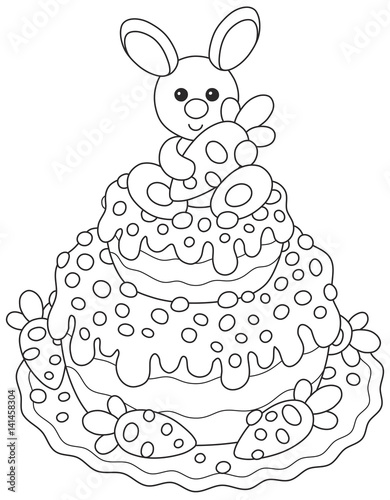 Festively decorated Easter cake with a small bunny and carrots
