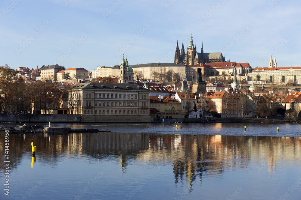 View on the colorful autumn Prague gothic Castle above River Vltava, Czech Republic