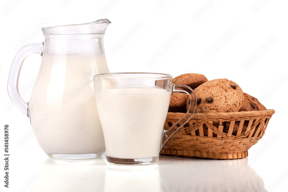 jug and glass of milk with oatmeal cookies in a wicker basket isolated on white background jug and glass of milk with oatmeal cookies in a wicker basket isolated on white background