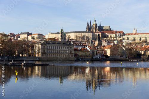 View on the colorful autumn Prague gothic Castle above River Vltava, Czech Republic