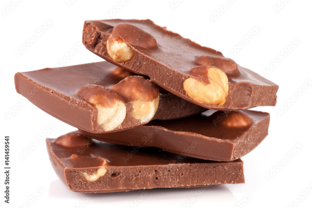 Chocolate with hazelnuts isolated on white background Chocolate with hazelnuts isolated on white background