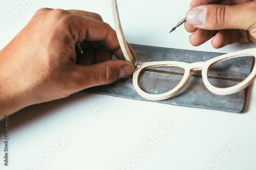 Crop shot of man producing sunglasses